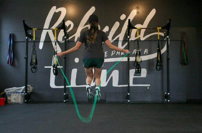Photo by Element5 Digital woman using jumping rope