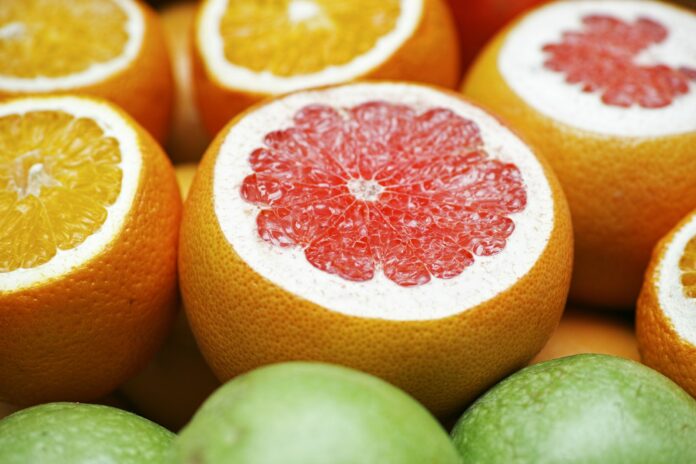 Photo by engin akyurt orange fruit on green fruit